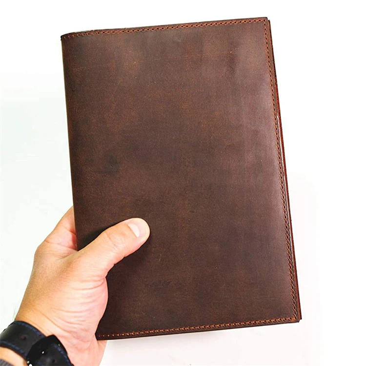 Notebook holder open showing lined pages and card slots