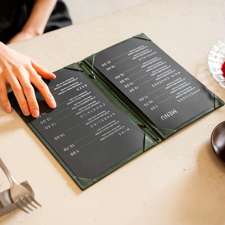 Stack of dark green leather menu holders