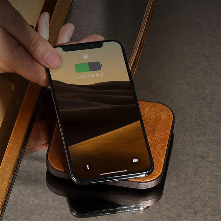 Close-up of stitched edge detail on the leather charging pad