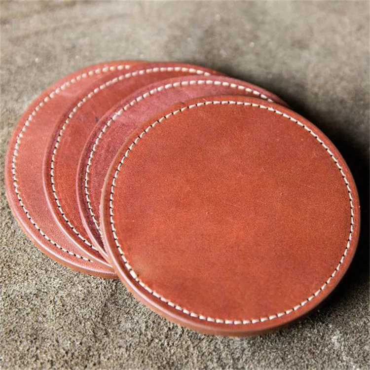 Circle leather coasters stacked on a table