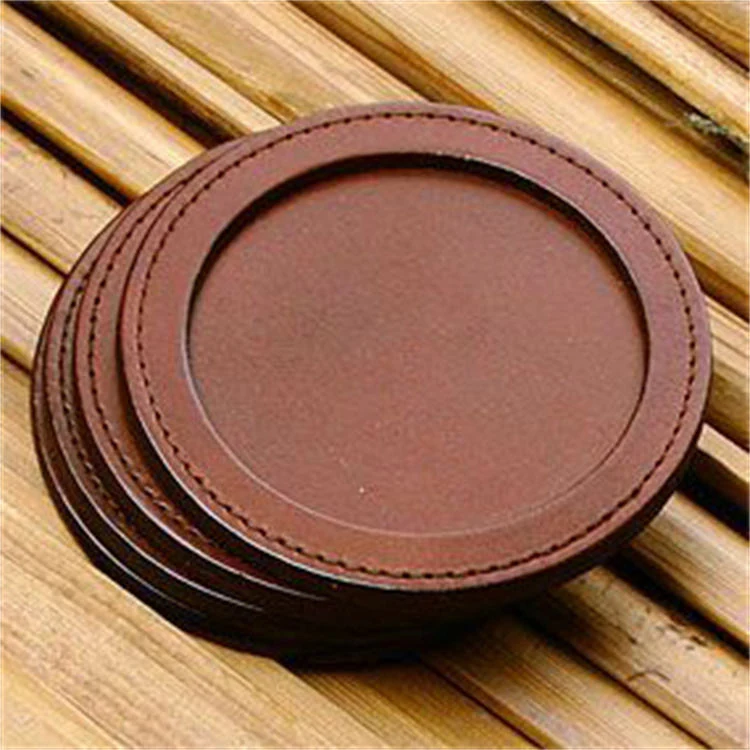 Black and tan puzzle-style leather coaster