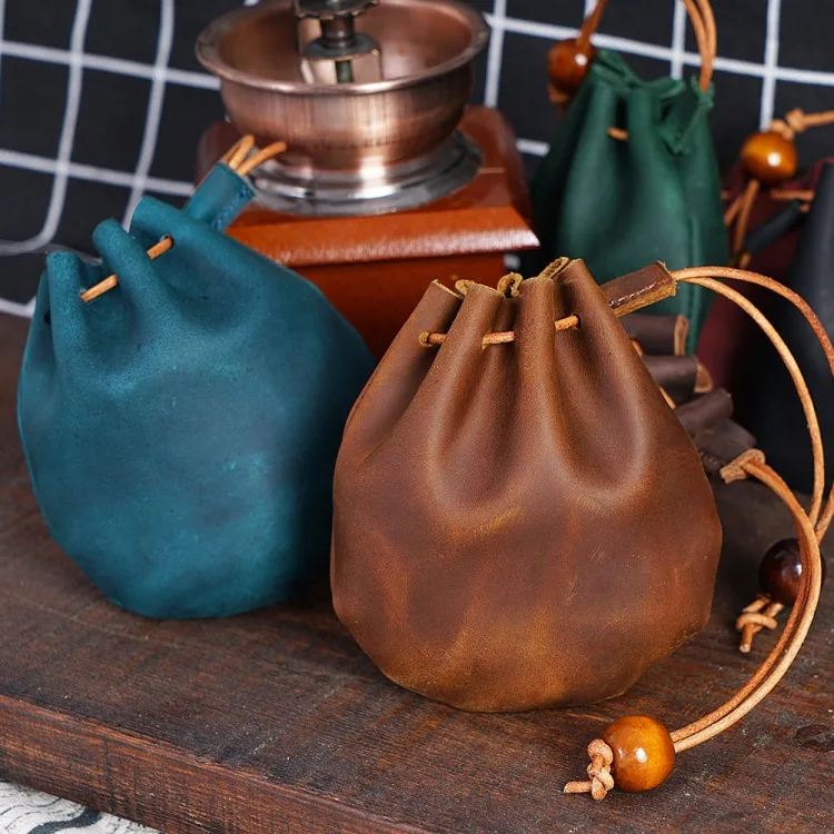Full-grain leather drawstring pouches in several colours