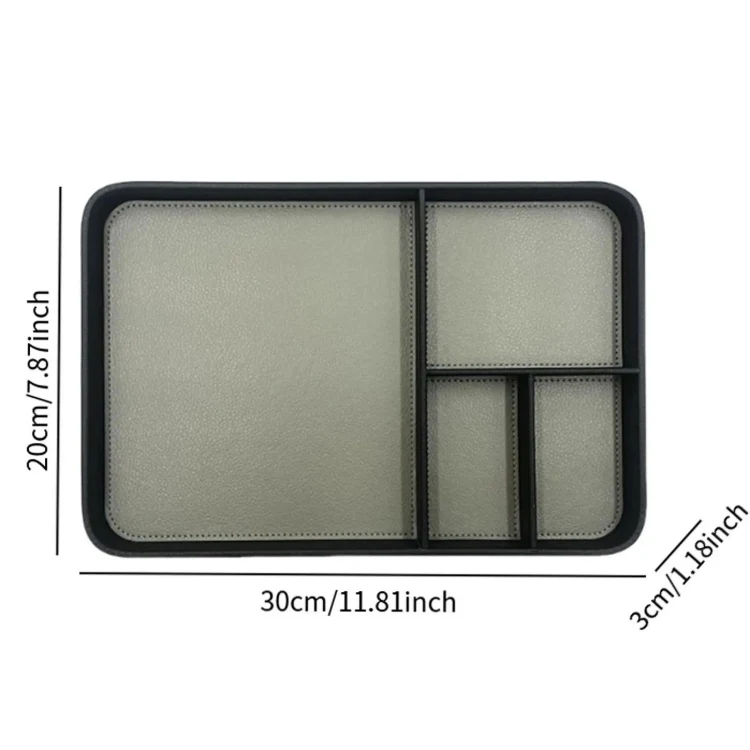 Tray holding a phone, earbuds and pens in separate compartments