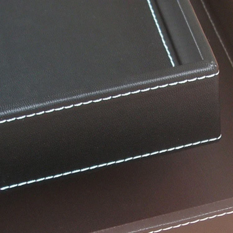 Detail of the leather tray base and raised edge