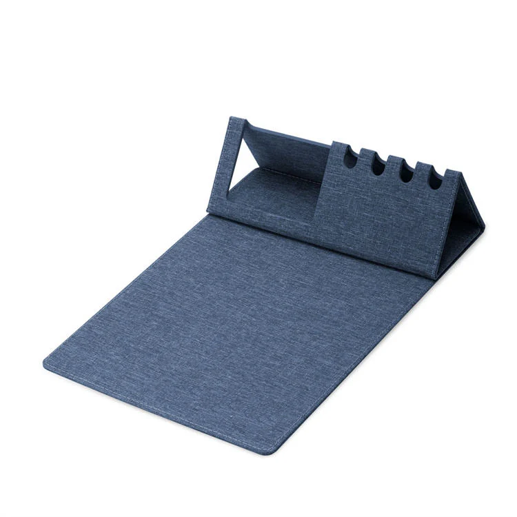 Foldable stand holding a tablet on the desk mat