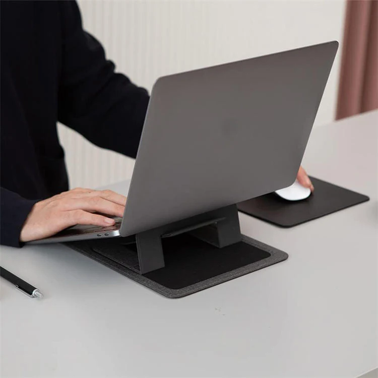 Laptop resting on the felt device stand