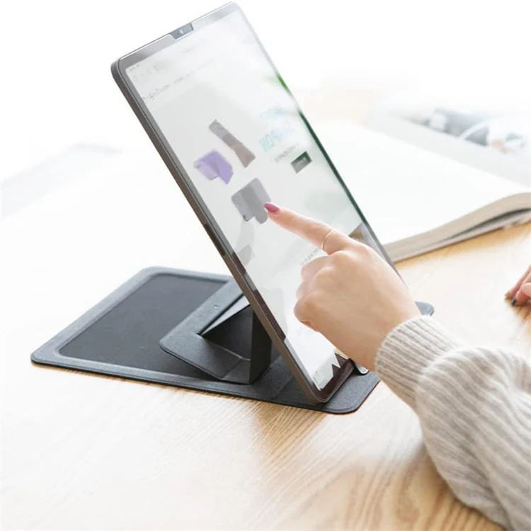 Stand mat folded to hold a tablet at viewing angle