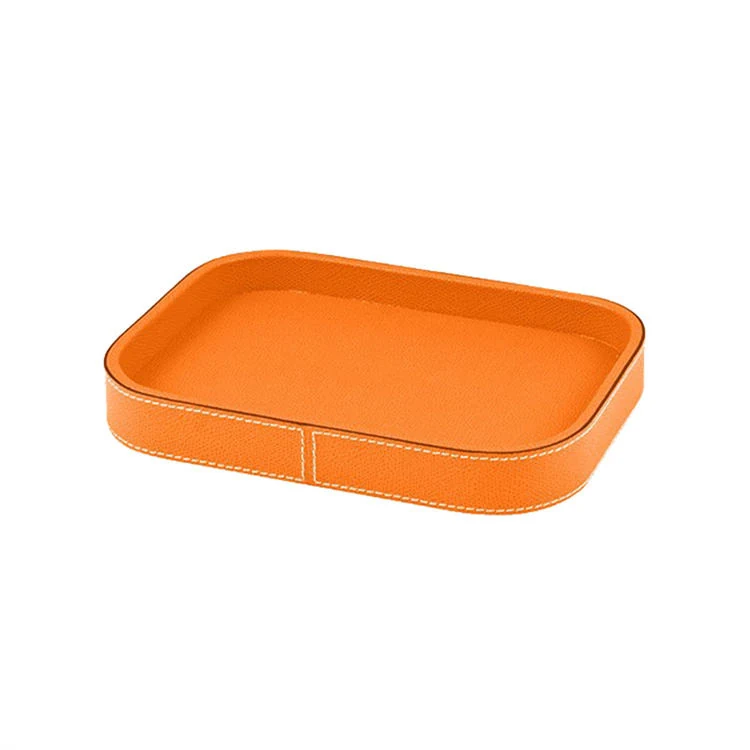 Several leather trays shown in different colours