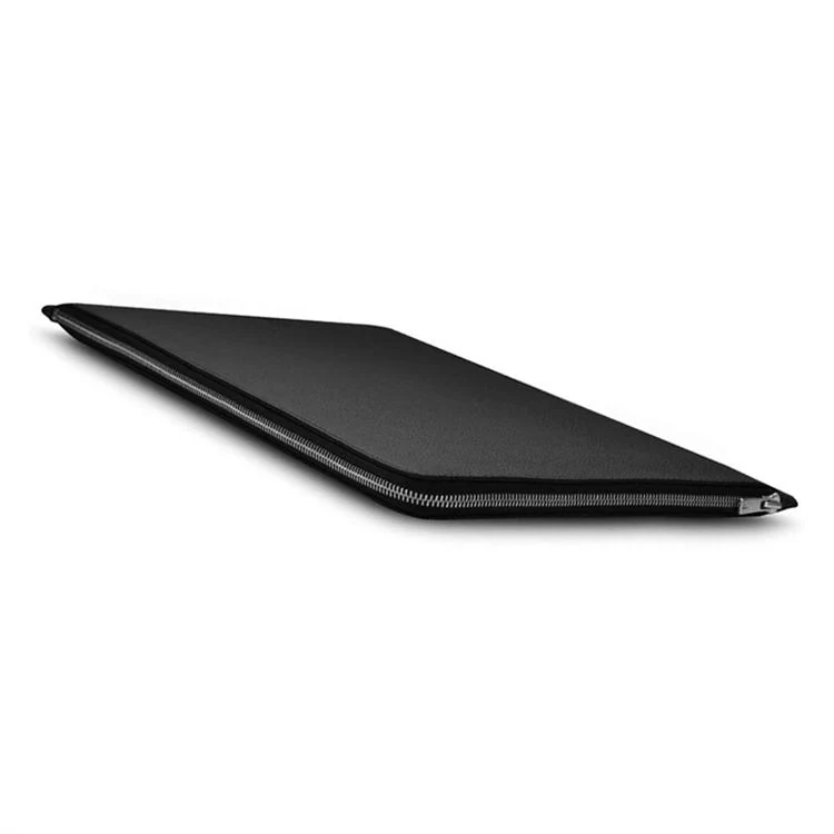 Tablet being slid into the leather zippered pouch