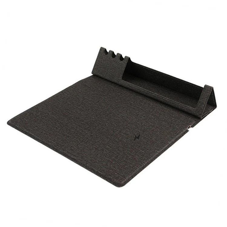 Phone charging on the Qi zone of the fabric mat