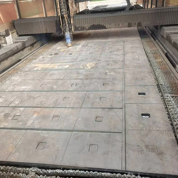 Cutting table with parts burned out of a large steel plate