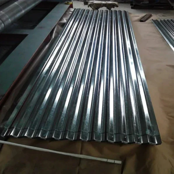 Corrugated galvanized steel roofing sheets stacked on the ground