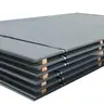 Stack of gray steel plates strapped over wooden battens