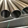 Close-up of three polished stainless steel round tube ends