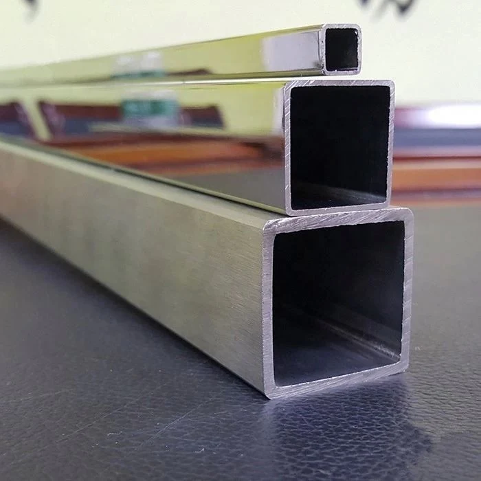 Two stainless steel square tubes showing open hollow ends