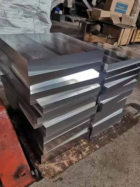 Polished steel plates stacked on a red painted rack