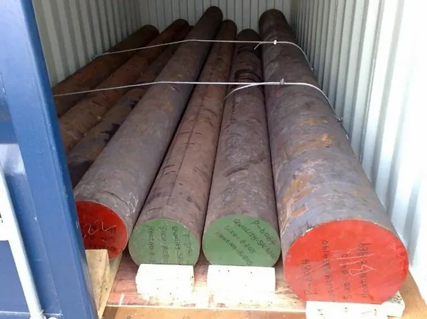 long round steel bars loaded and secured inside a shipping container