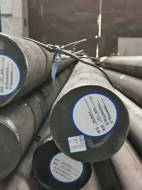 ends of heavy round steel bars carrying blue circular labels