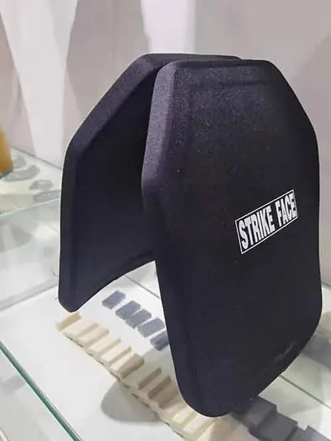 two armor plates standing in a glass display cabinet
