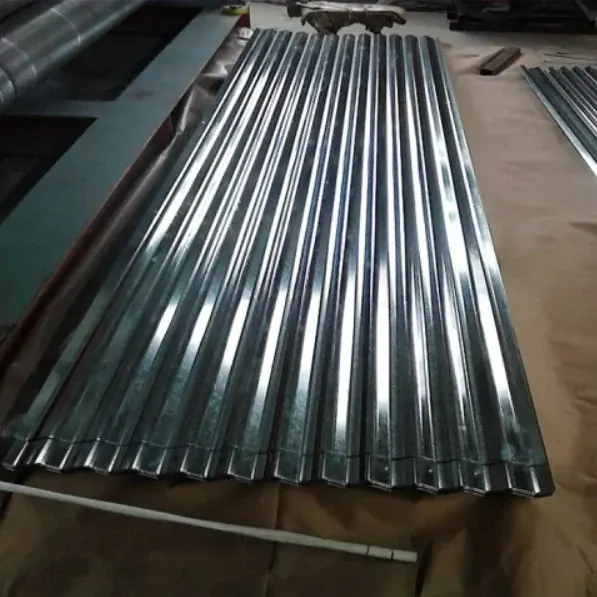 Corrugated galvanized steel roofing sheets stacked on the ground