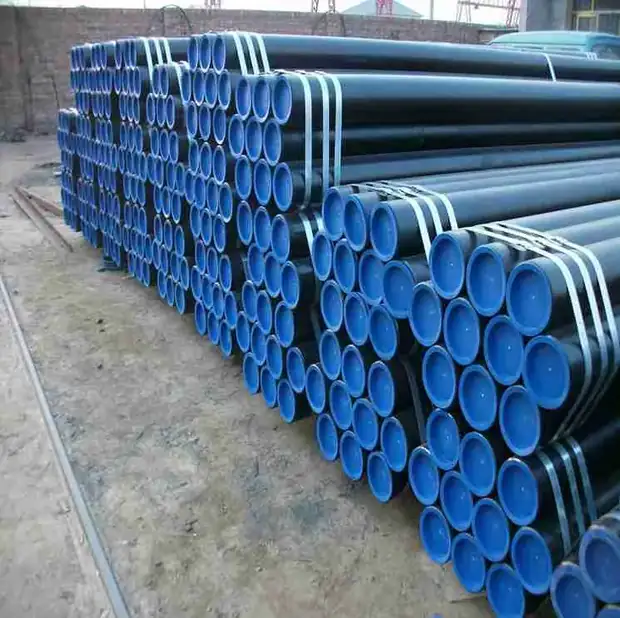 Blue coated steel pipes stacked in bundles in an outdoor yard