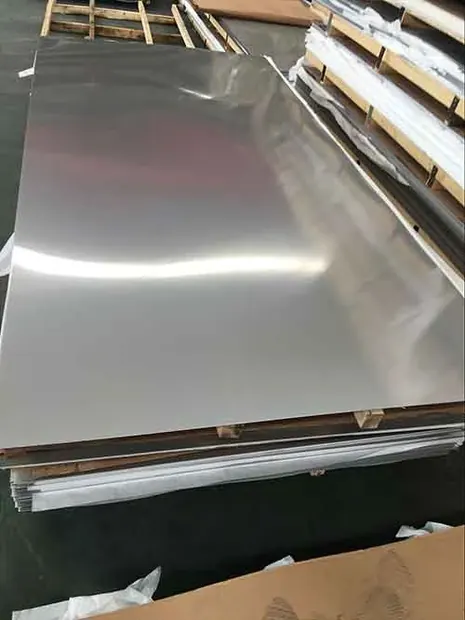 Mirror finish stainless steel sheet leaning against a stack