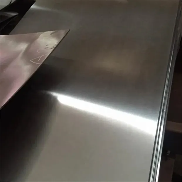 Close-up of a brushed stainless steel sheet catching the light
