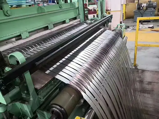Slitting line cutting a steel coil into narrow strips