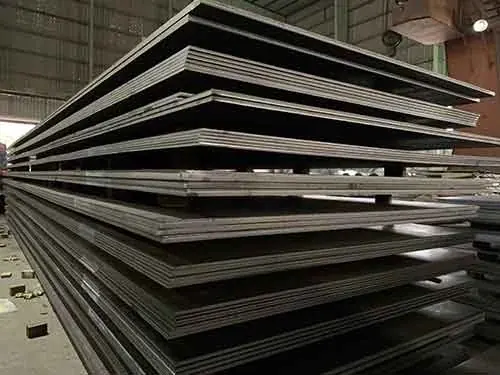 Tall stack of hot rolled steel plates seen from the corner