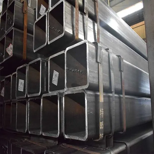 Stack of black rectangular steel tubes with paper labels