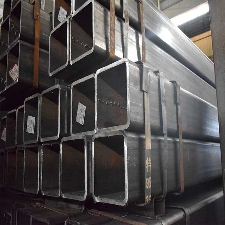Stack of black rectangular steel tubes with paper labels