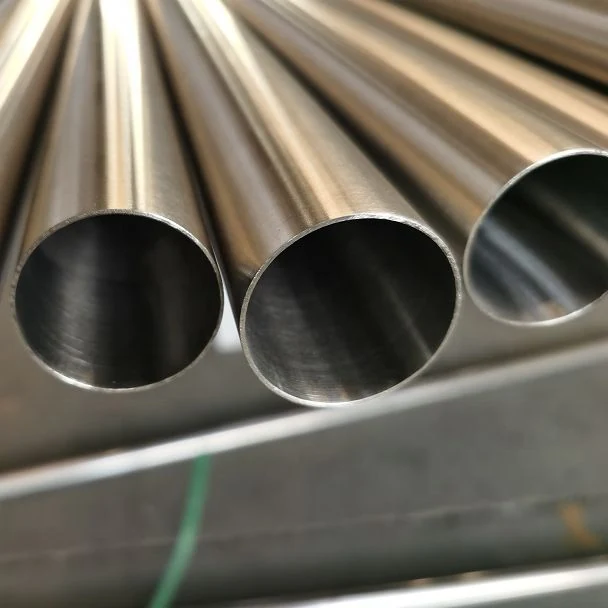 Close-up of three polished stainless steel round tube ends