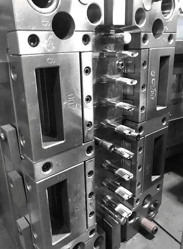 Mould half showing slide pockets, angle pins and machined steel inserts