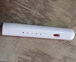 White moulded electric toothbrush handle with moulded button apertures