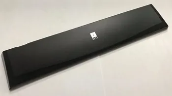 Long glossy black plastic cover with a small square printed mark