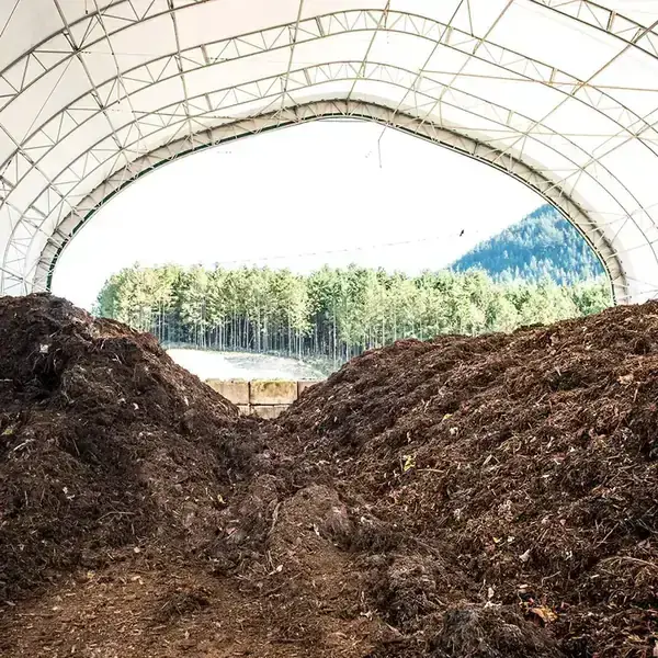 Open windrow composting piles that need months and large land area