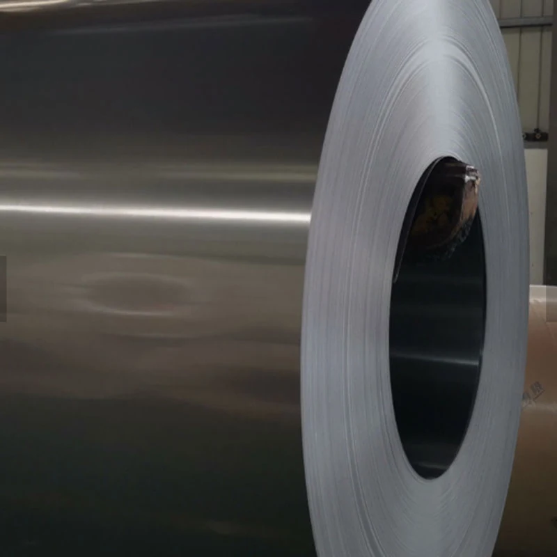 Coil of insulation-coated silicon steel strip on the workshop floor