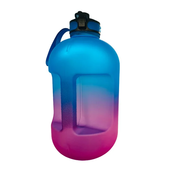 Hand holding the bottle with the nylon strap, demonstrating easy carry