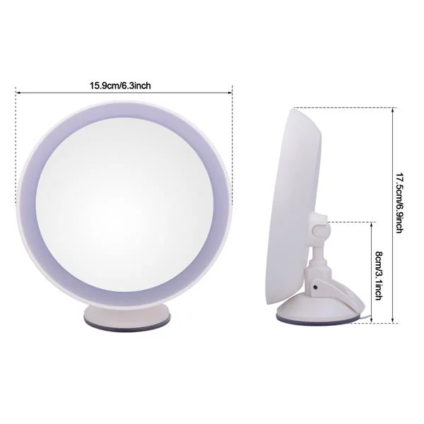 Mirror next to a sink with a hand holding a contact lens for insertion