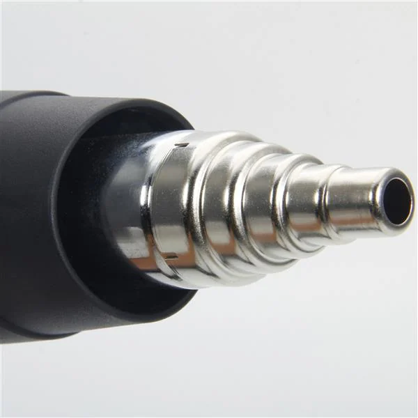 Close-up of a chrome stepped concentrator nozzle tip attached to a black heat gun against a plain background