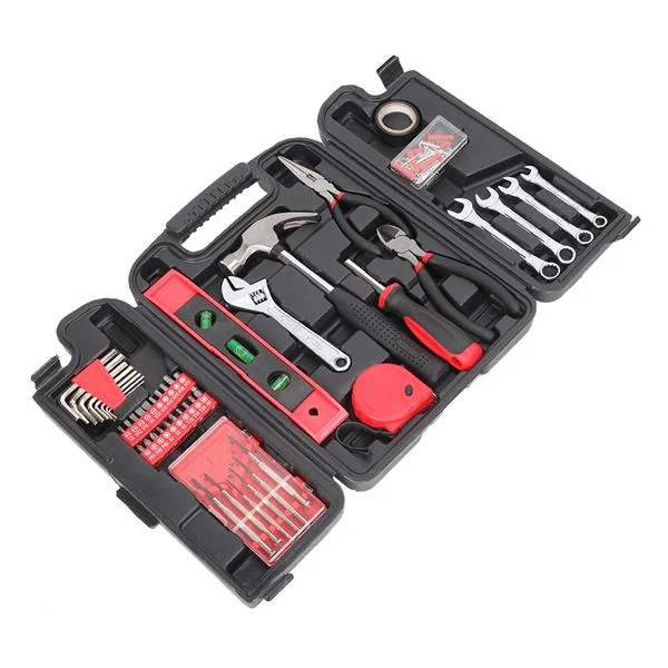 Level and measuring tape from the tool set laid out on a workbench
