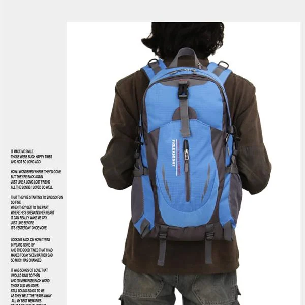 Backpack placed on a hiking trail with a water bottle attached to the D-ring
