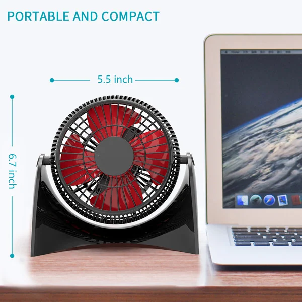 Fan placed on a notebook computer with airflow visible in the air