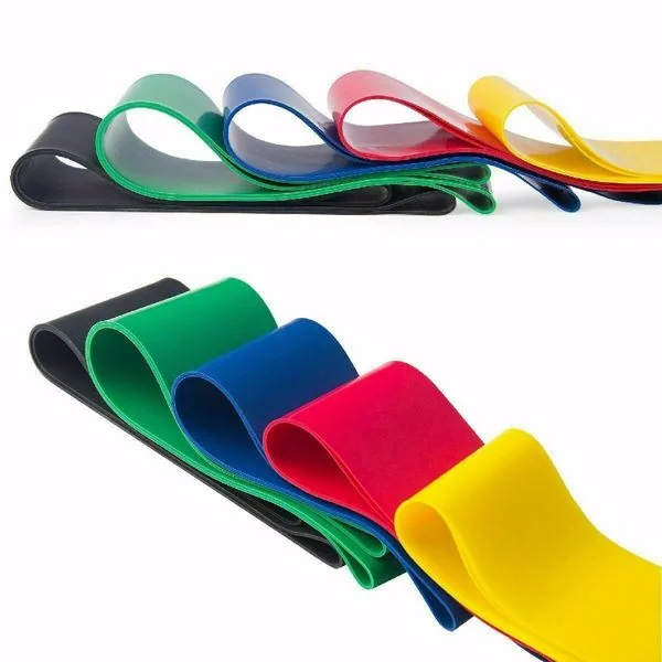 Resistance bands placed on a training mat with a person performing a leg lift exercise