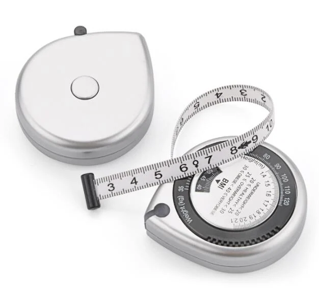 Silver BMI waist measuring tape with extended dial tape and markings beside a closed case on a white background