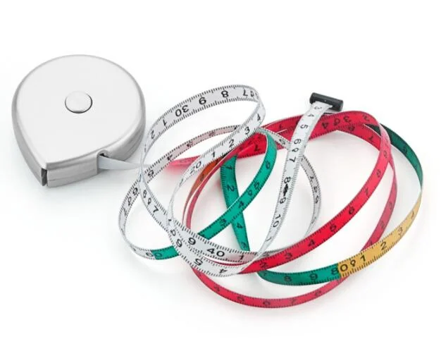 Silver retractable BMI waist tape measure with coiled white, red, green and yellow measuring tapes on a white background
