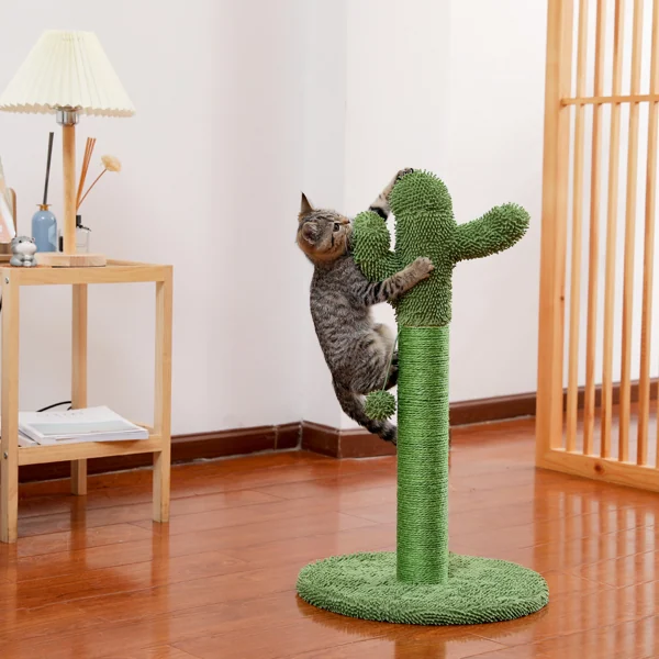 Cat playing with the interactive ball on top of the scratching post