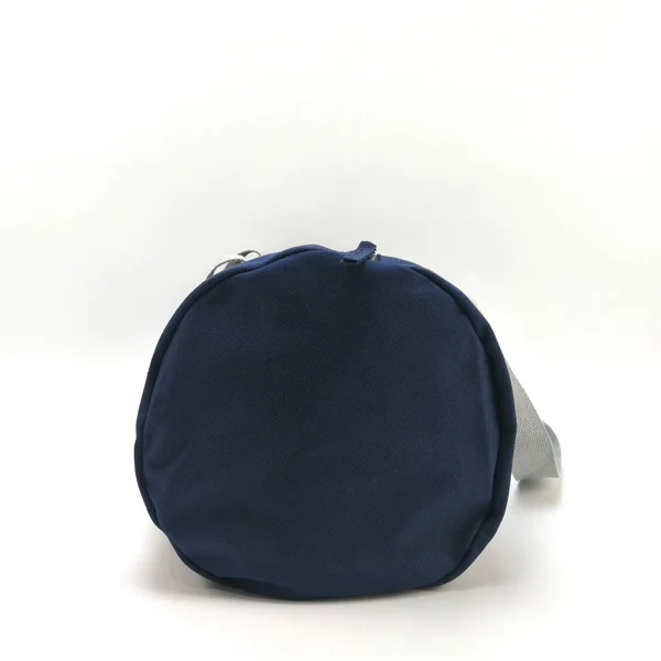 Tote being carried by the reinforced handles with a load inside