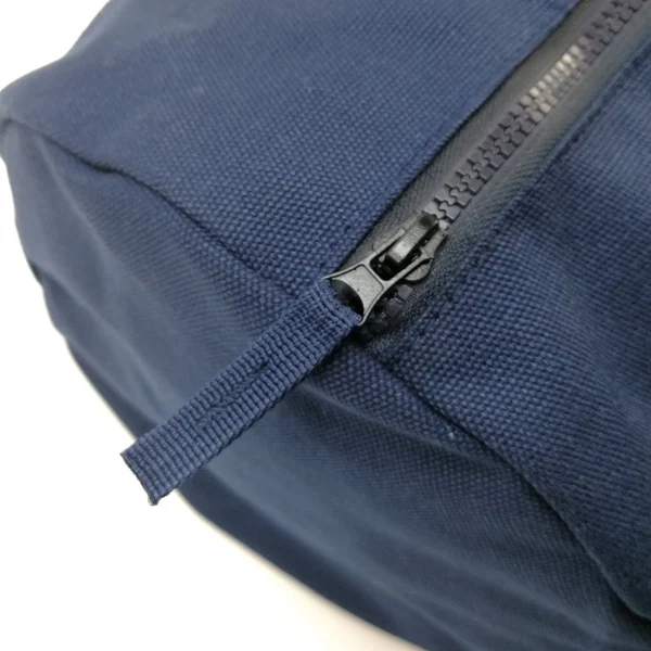 Tote laid flat with the internal pocket visible and the zipper open