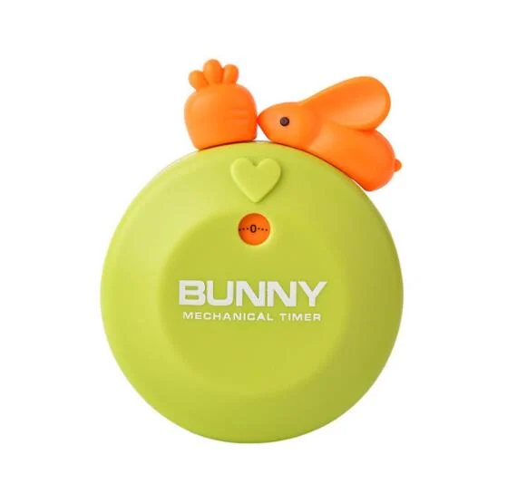 Green round mechanical kitchen timer with orange cartoon rabbit on top and BUNNY text on its face